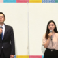 two young Asian people speak into microphones