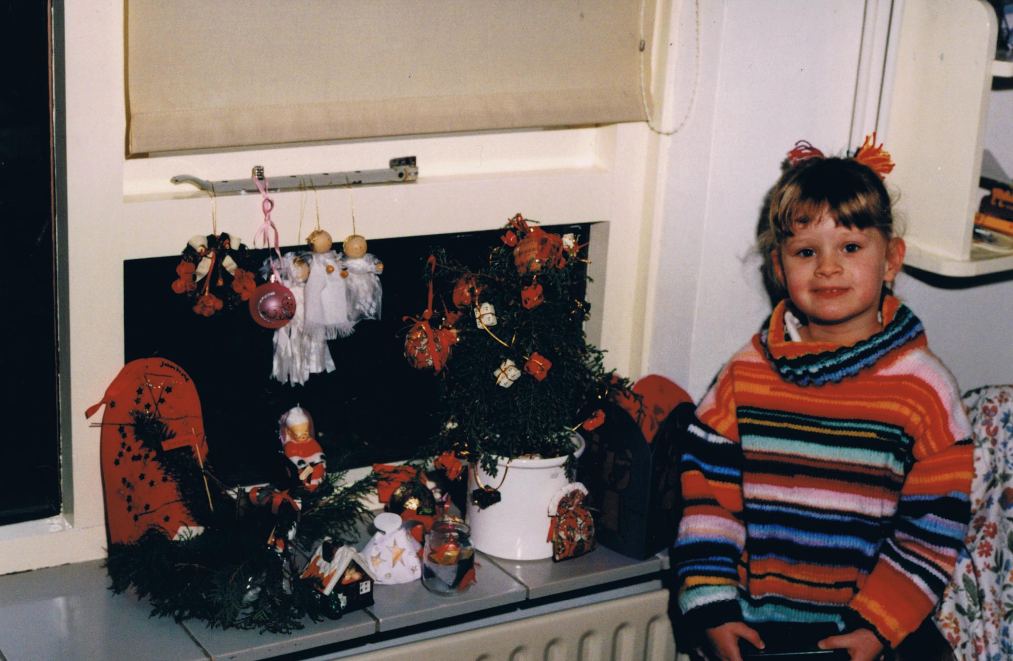 Jantine Huisman as a child with Christmas decorations. Photo courtesy of Jantine Husiman. 